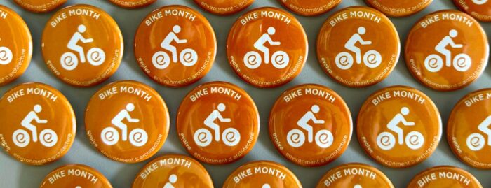 evolve branded buttons to celebrate Bike Month in May